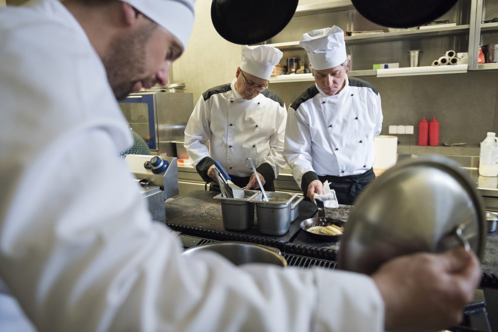 Hardworking chefs working at dinner